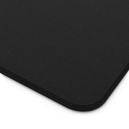 Dragon Ball Z anime desk mat showing a close-up of the textured black surface with stitched edges.