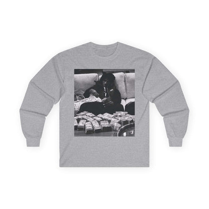 YoungBoy moneystack tee featuring a vintage gray long sleeve shirt with a monochrome photo of a person lounging with stacks of cash.
